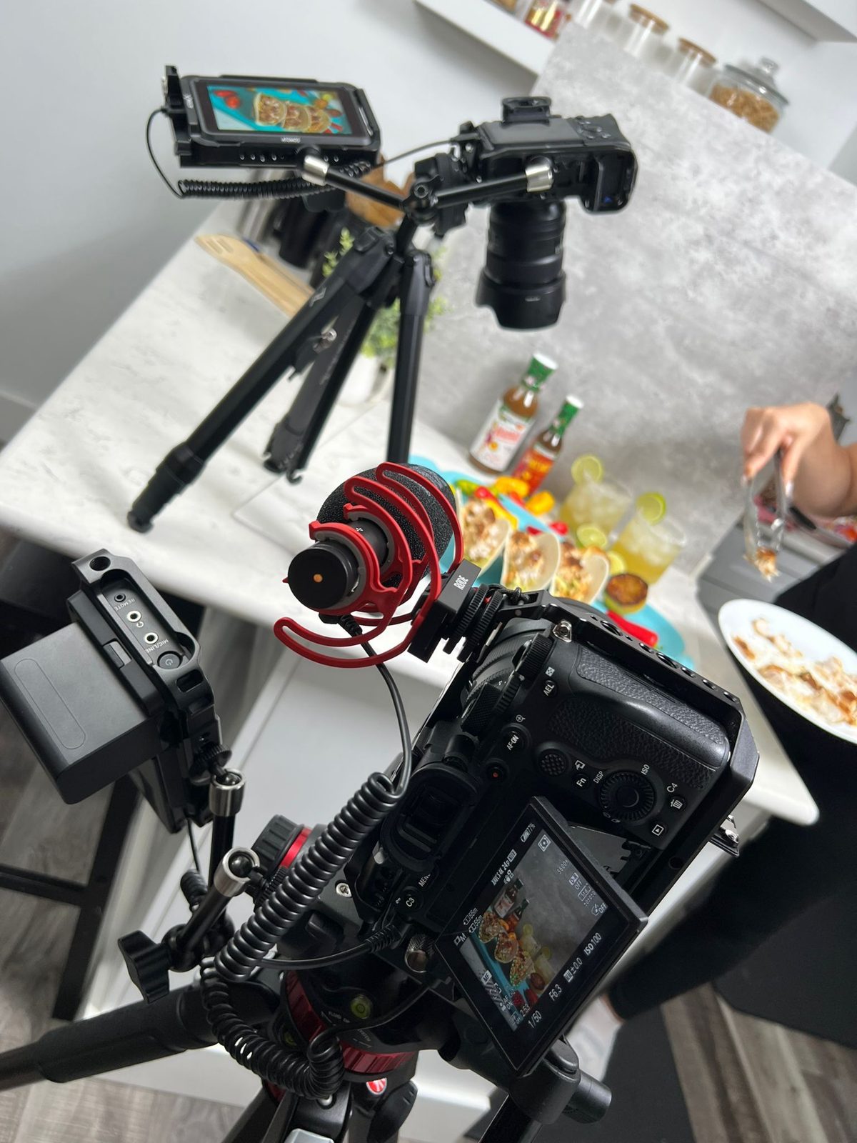 Audio recorder and gimbal rig beside a food set