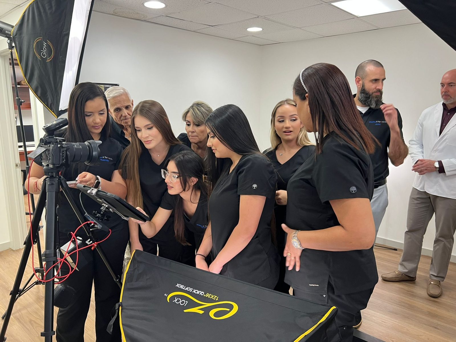 Team lined up for headshot day at a medical office