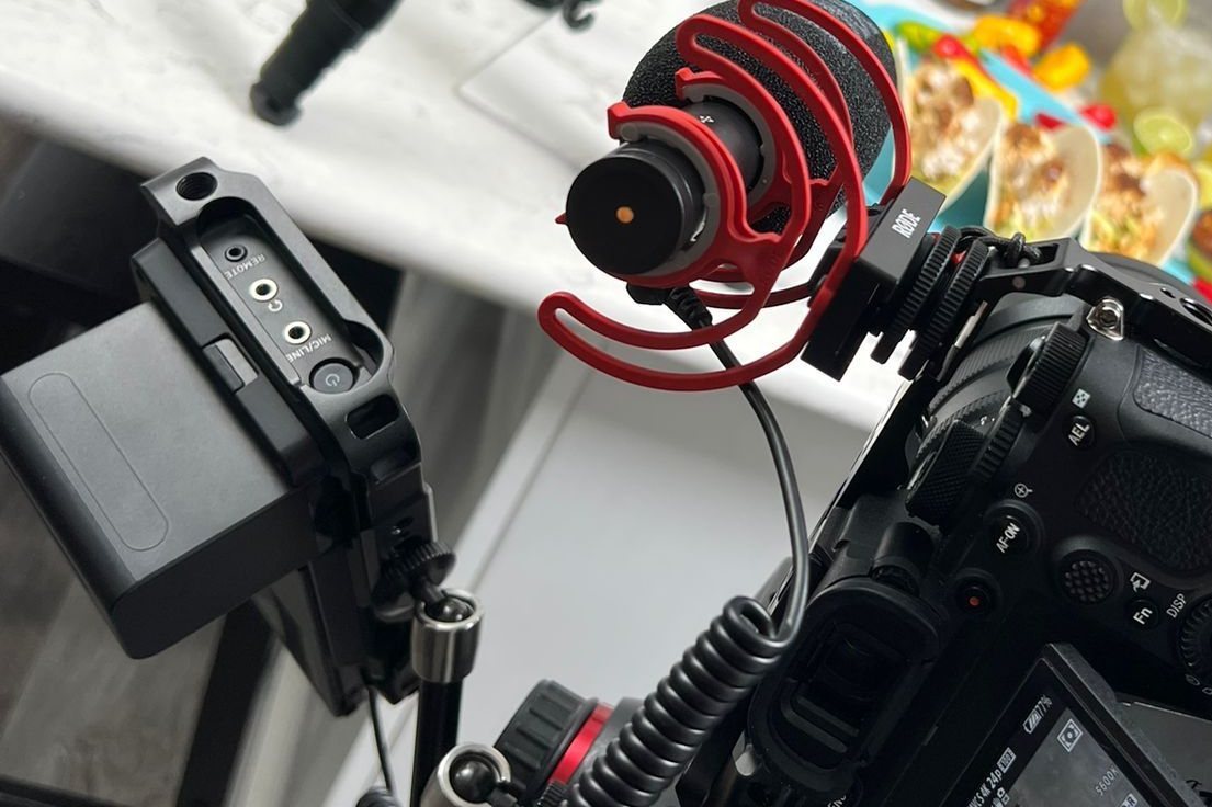 A cinema camera rig with a shotgun microphone, set up for a shoot