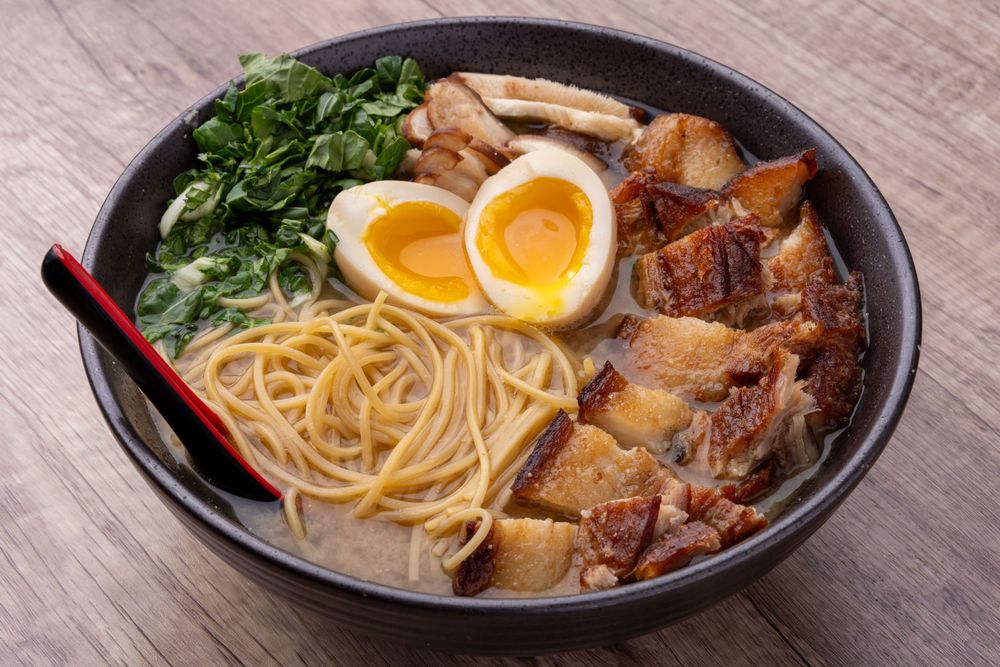 Ramen with soft boiled eggs and greens