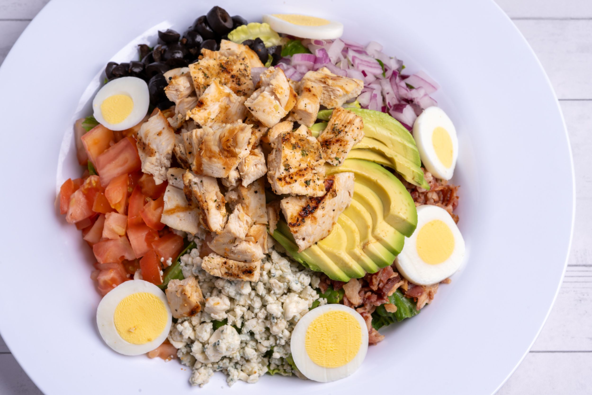 Cobb salad with eggs, avocado, and blue cheese