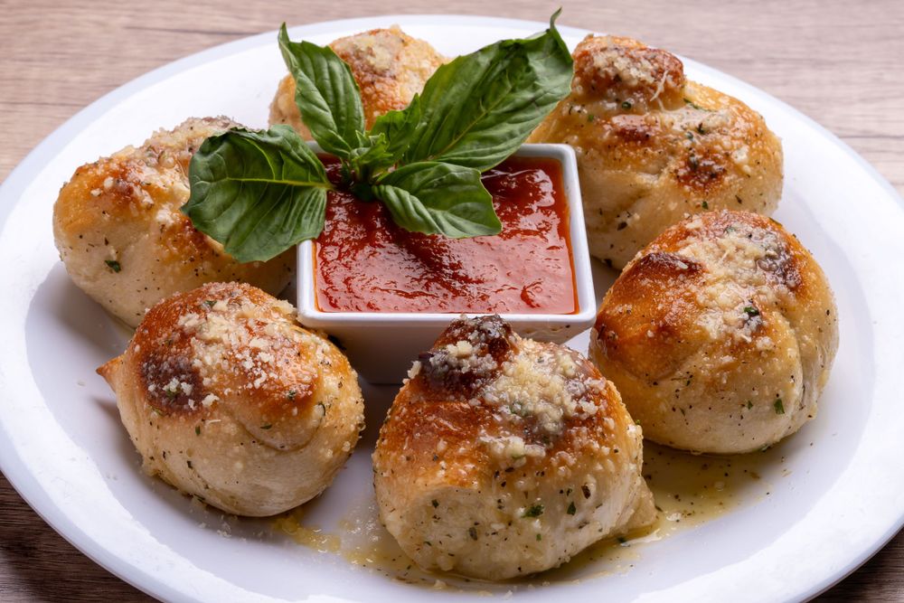 Garlic knots with marinara and basil