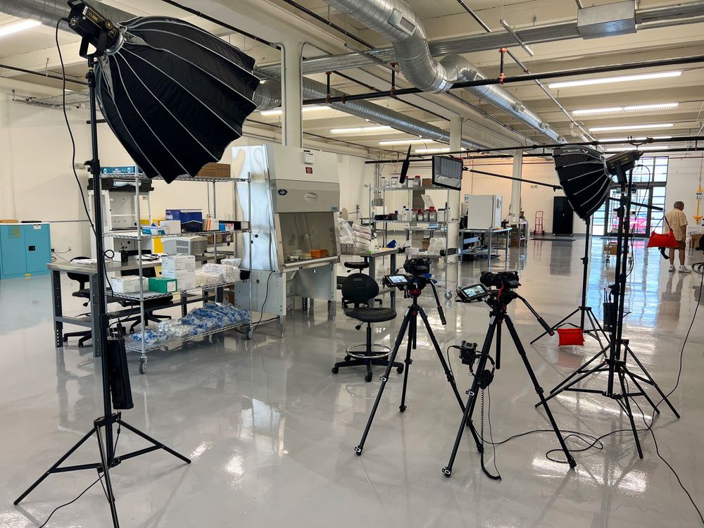 Softboxes and cameras placed around a working lab for a brand film
