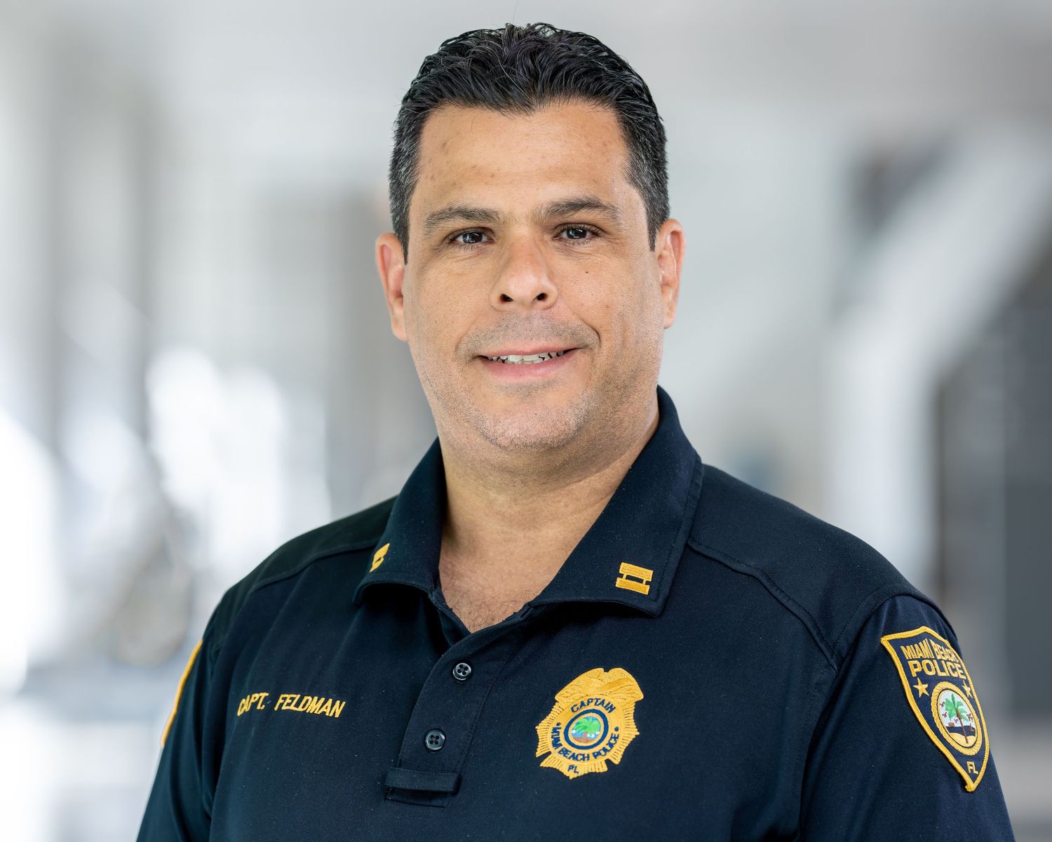 Headshot of a police captain, photographed at his department